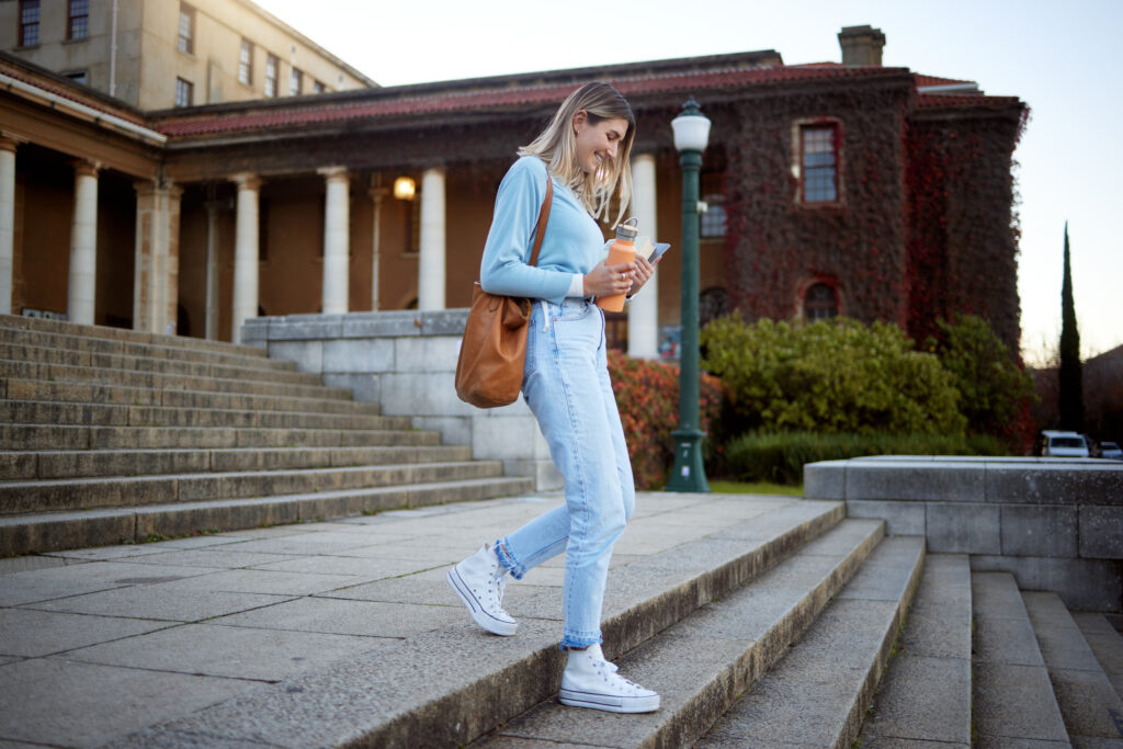 Student sitting on campus stairs
