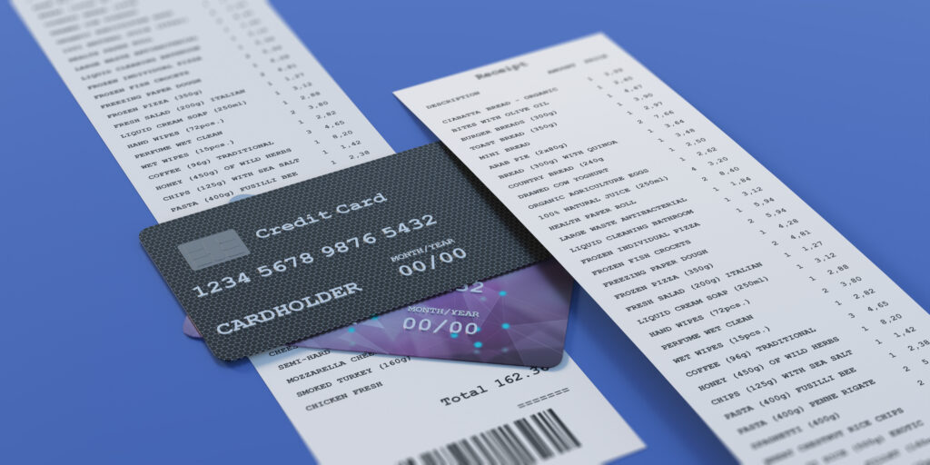Credit cards and a paper receipt on a blue background