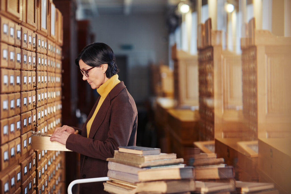 Librarian cataloguing books