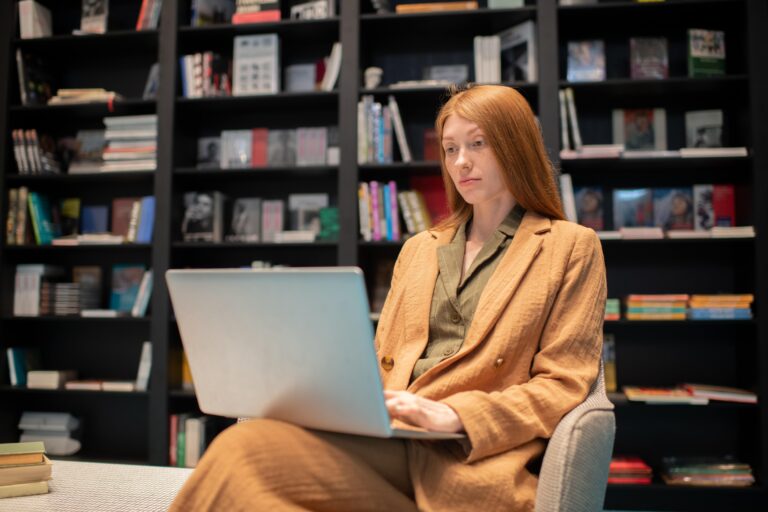 Researcher reading an ebook on a laptop